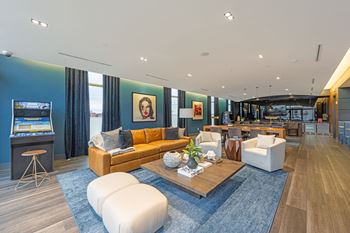 a living room with blue walls and a yellow couch